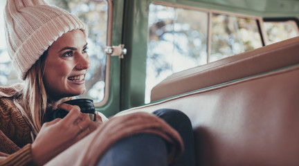 Woman on roadtrip travelling by van