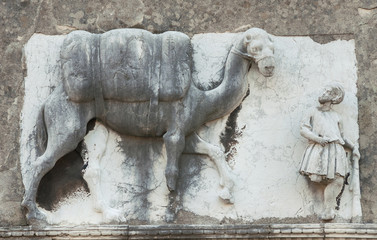 Moorish merchant with camel or dromedary old relief on a wall in the historic of Venice, along Rio della Sensa canal (15th-16th century, author unknown)