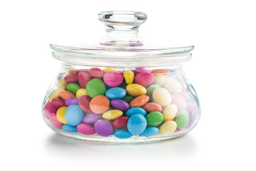 Colorful chocolate candies in jar.