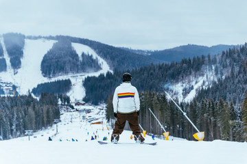 people skiing and snowboarding at winter  mountains