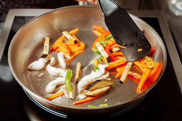 Roasting vegetables and mushrooms.