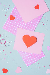 Valentines day background. Valentine card with heart and craft paper on the blue background