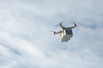 Technological delivery innovation - fast drone delivery concept above town