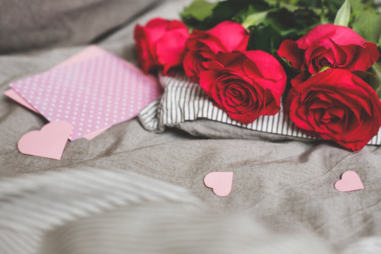 Romantic background with copy space. Beautiful roses and card with heart. Selective focus