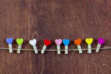 On a string, clothespins in the form of hearts. Valentine's Day.