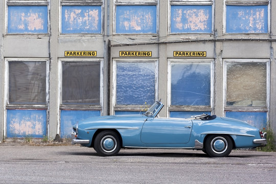 Blue Car in front of Parking in Copenhagen Denmark