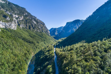 Naklejka premium aerial view of the canyon with the river and the road in the mountains of Montenegro