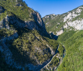 aerial view of the canyon with the river and the road in the mountains of Montenegro