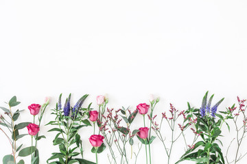 Flowers composition. Border made of various colorful flowers on white background. Flat lay, top view, copy space