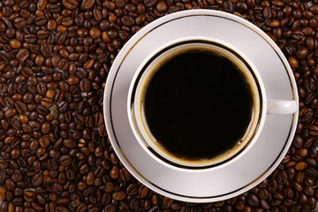Coffee beans, Grains of coffee and a cup of coffee
