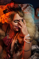 Retro portrait of a beautiful Gatsby woman. Smiling Girl. Vogue fashion style and smoke