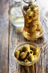  olive oil in a crystal bottle on wooden background