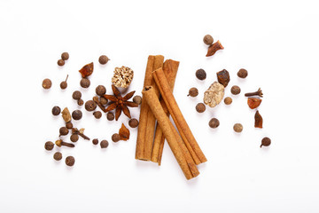 Spices for mulled wine. Spices for mulled wine isolated white background. Cinnamon sticks, roast pepper, ginger, tubberry, nutmeg, cardamom, cloves.