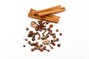 Spices for mulled wine. Spices for mulled wine isolated white background. Cinnamon sticks, roast pepper, ginger, tubberry, nutmeg, cardamom, cloves.