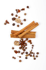 Spices for mulled wine. Spices for mulled wine isolated white background. Cinnamon sticks, roast pepper, ginger, tubberry, nutmeg, cardamom, cloves.