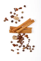 Poster Spices for mulled wine. Spices for mulled wine isolated white background. Cinnamon sticks, roast pepper, ginger, tubberry, nutmeg, cardamom, cloves. © Alexander
