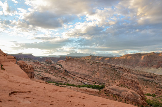 cliffs of Salt Valley at sunrise panoramic view from Delicate Arch
Arches National Park, Moab, Utah