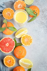 Citrus fruits. Mandarin, grapefruit, lime, tangerine, lemon and juice. Top view