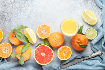 Citrus fruits. Mandarin, grapefruit, lime, tangerine, lemon and juice. Top view