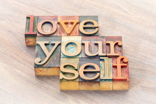 love yourself word abstract in wood type