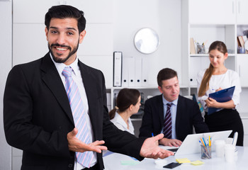 Successful business group with smiling man foreground