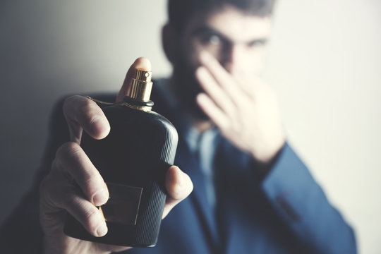 man hand bad odor perfume