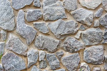 Decorative modern stone wall of chipped stone for background