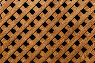 Background, diagonal wooden grille. Texture of the wooden lattice.