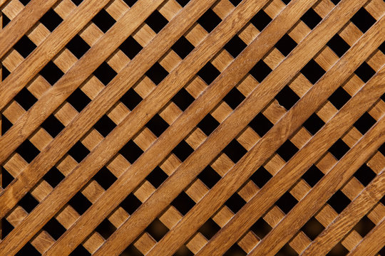 Background, diagonal wooden grille. Texture of the wooden lattice.