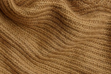 коричневая текстура из части старого шерстяного свитера