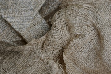 серая текстура  из куска рваного грязного мешка