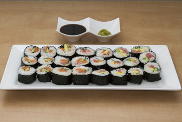Sushi rolls with soy sauce and wasabi