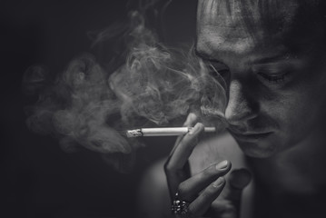 Fototapeta premium Smoking and thoughtful man