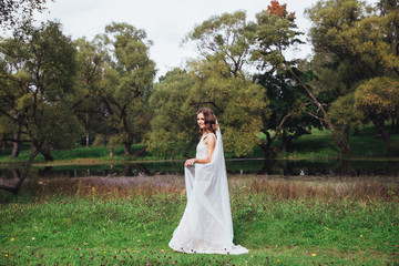 Sensual and elegant bride in the park