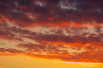 Fiery, orange and red colors sunset sky as background