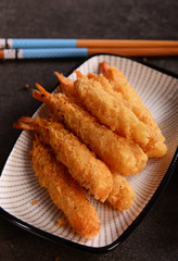 Fried shrimps on sticks in crispy coating