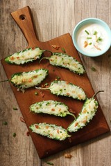 Homemade Jalapeno Poppers with dipping sauce overhead view