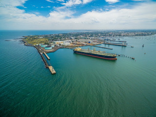 Aerial view of industrial docks and nautical vessel at Yarra river mouth. Williamstown, Melbourne,...