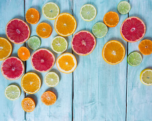 citrus fruit slices on turquoise background