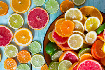citrus fruit slices on turquoise background