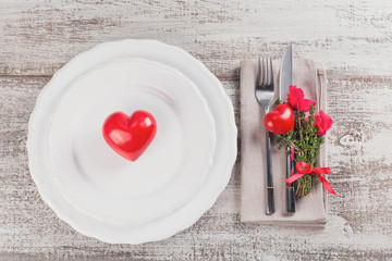 Rustic table setting with thyme and cyclamen flowers