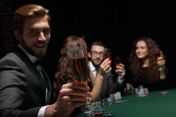 poker player with a glass of wine