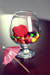 glass with candy pill