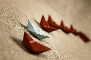 toned colored paper boats glass