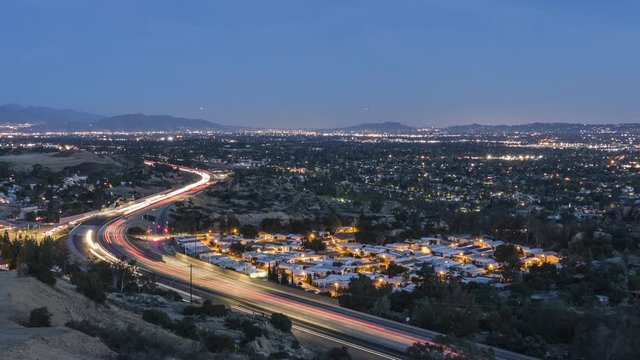 Dusk to night time lapse view of route 118 freeway near Topanga Canyon Bl in the San Fernando Valley area of Los Angeles, California.