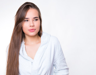 beautiful young woman with long hair wearing bath robe