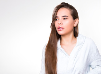 Obraz premium beautiful young woman with long hair wearing bath robe