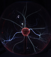 Plasma lamp. High-voltage arc at coil of Tesla. Abstract concept of electric power.