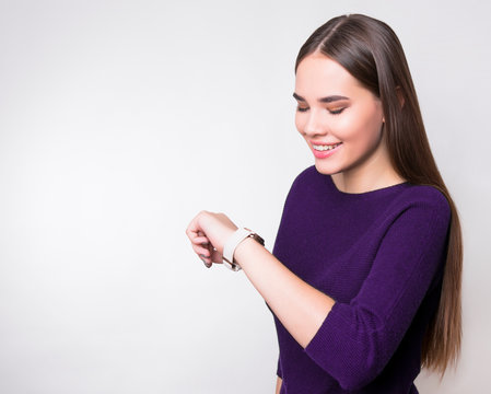 beautiful young woman with long hair wearing wrist watch