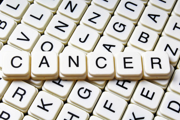 Cancer text word crossword title caption label cover background. Alphabet letter toy blocks. White alphabetical letters.